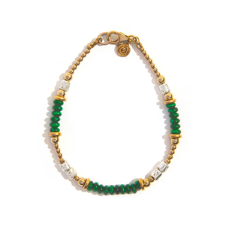 The Lava Malachite Two-Tone Bracelet is a striking 7.5-inch accessory featuring lava beads and malachite rondels, elegantly silver- and 14ct gold-filled for a polished finish. This unique design combines the rugged texture of lava stones with the vibrant green of malachite, creating a bold yet sophisticated look perfect for any occasion.