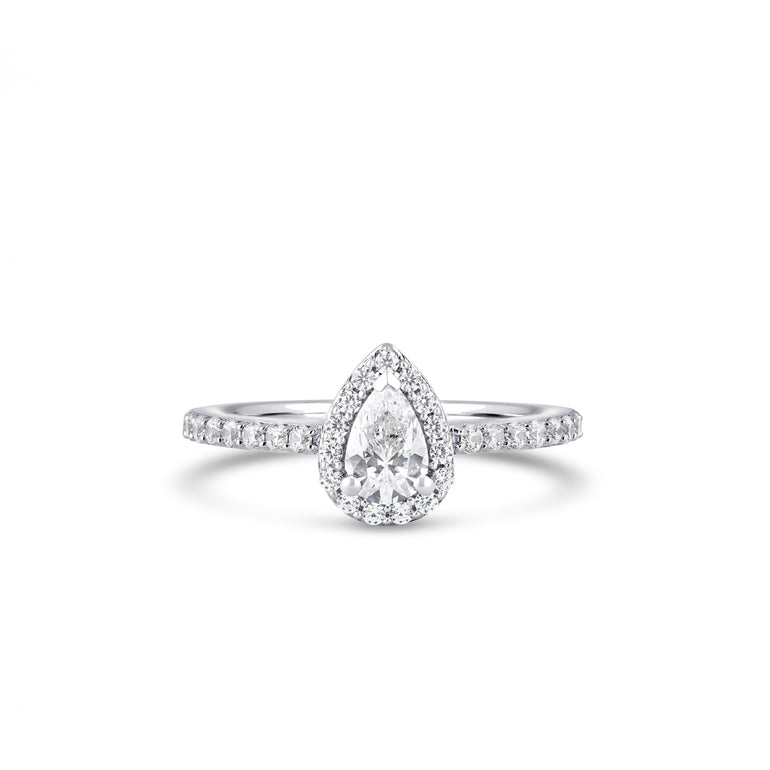 Explore our stunning Pear Cut Diamond Ring with Diamond Side Stones, crafted in 18ct white gold, yellow gold, or platinum. Featuring a 0.60ct lab-grown diamond as the center stone, this ring boasts a total diamond weight of 1.01ct. Each ring is custom-made for a perfect fit. Material: 18ct White Gold (Also Available in Yellow Gold or Platinum). Center Stone: 0.60ct Pear Cut Lab Grown Diamond. Total Diamond Weight: 1.01ct. Characteristics: E Colour, VVS1 Clarity. Customization: Made to Order
