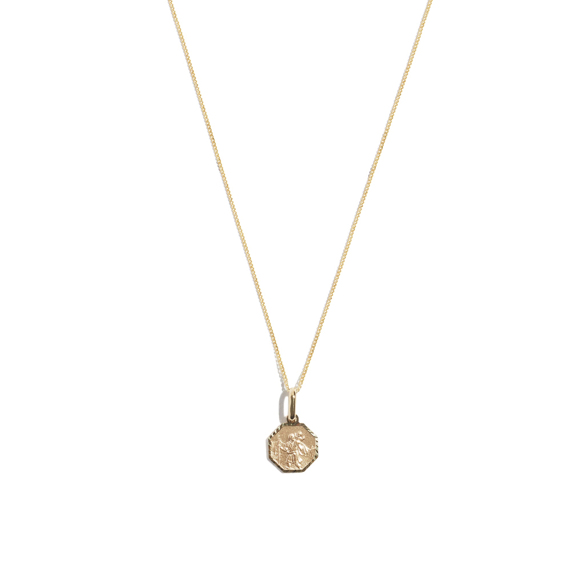 Discover the timeless elegance of the 9 carat yellow gold St Christopher Hex Necklace. This stunning accessory with the revered St Christopher, symbolizing protection and guidance during travels.