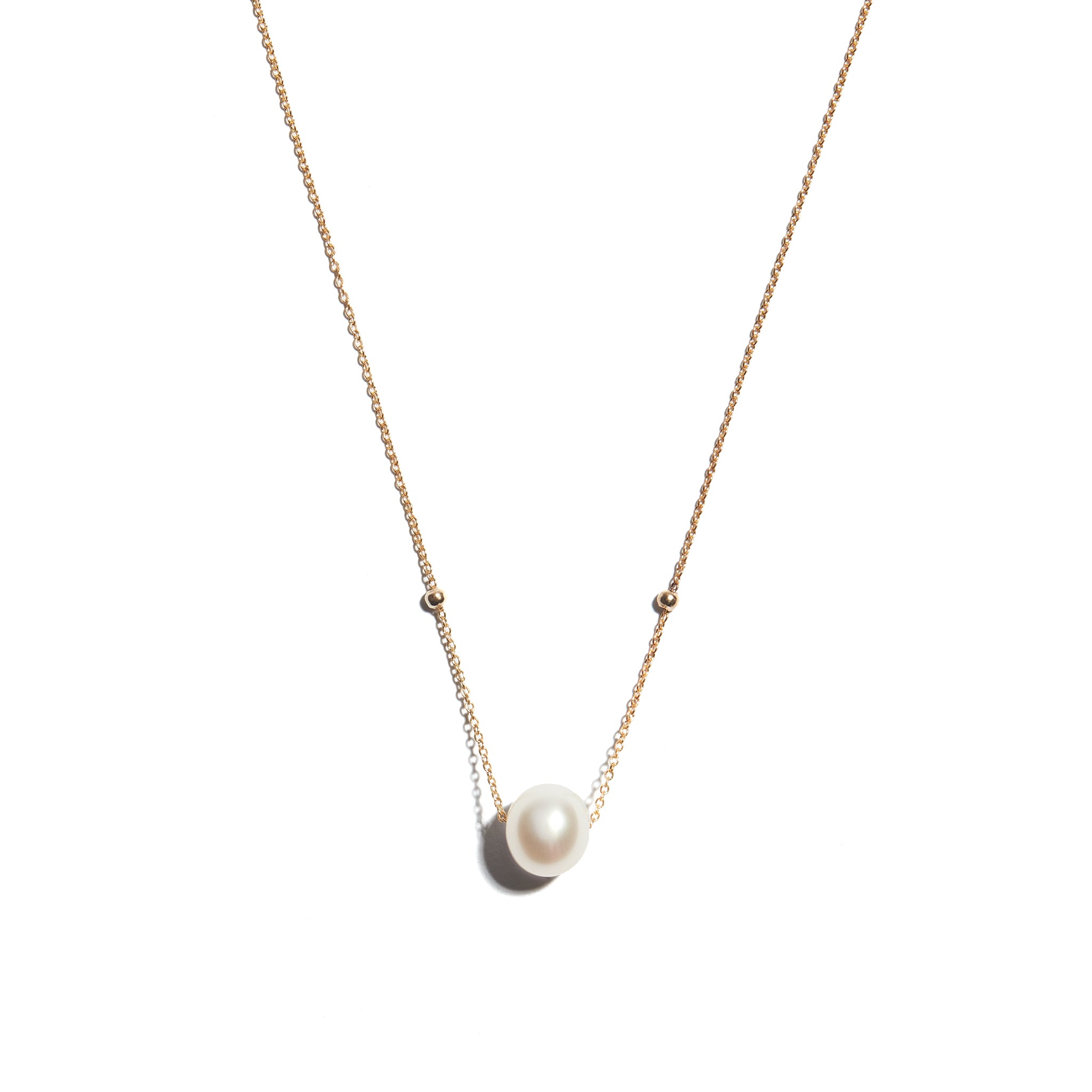 Stunning 9 carat gold pendant featuring a lustrous pearl centerpiece. The exquisite combination of gold and pearl creates a captivating and elegant accessory, perfect for any occasion.