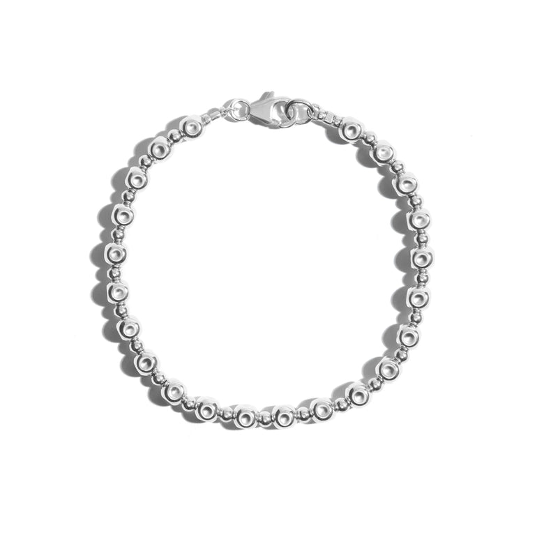 A stylish beaten beaded bracelet crafted from sterling silver perfect for adding a touch of sophistication to any outfit.