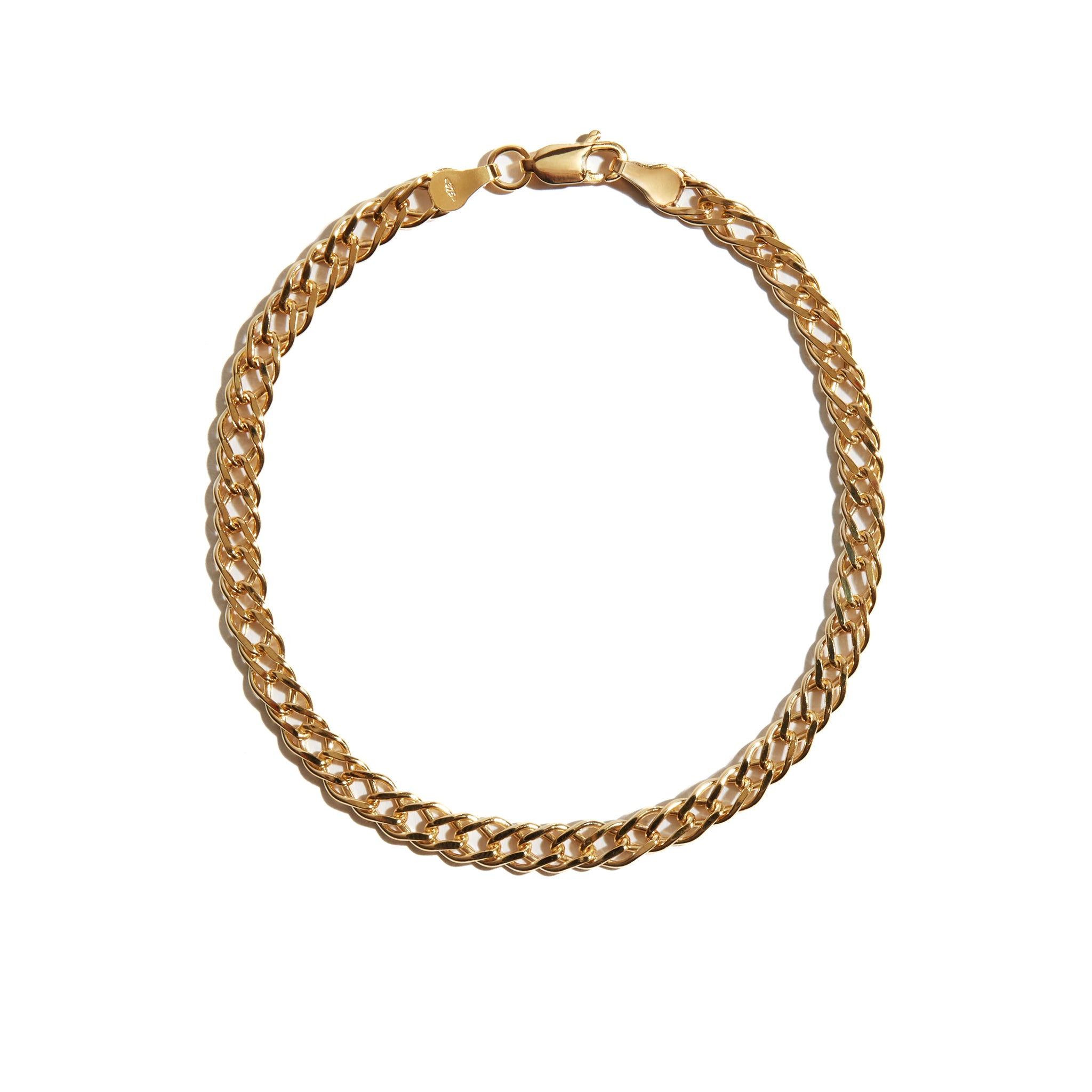 A stunning diamond-cut double curb bracelet made from 9 Carat Gold, adding sparkle and elegance to any wrist.