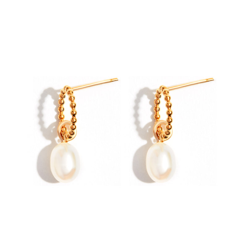 Bubble Pearl Drop Earrings  These elegant stud earrings feature a half-hoop design adorned with lustrous pearls. The drop pearls measure 6/9, creating a sophisticated and timeless look. Crafted with a high-quality gold-filled finish, these earrings are perfect for adding a touch of luxury to any outfit.