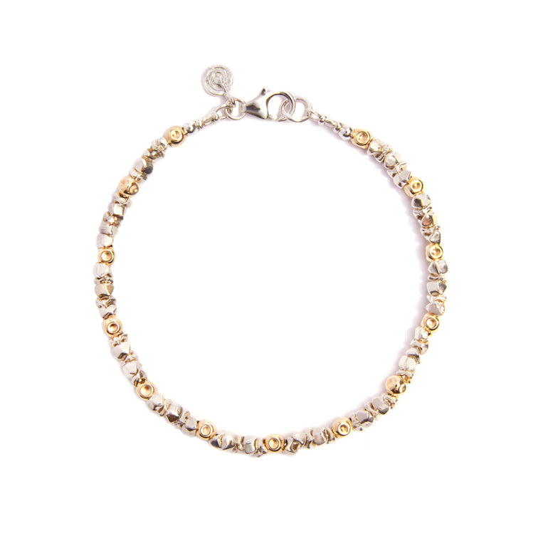 Our "Stellar Sparkle Silver & Gold Bracelet " a captivating blend of sterling silver and radiant gold. With intricate diamond-cut patterns adorning the sterling