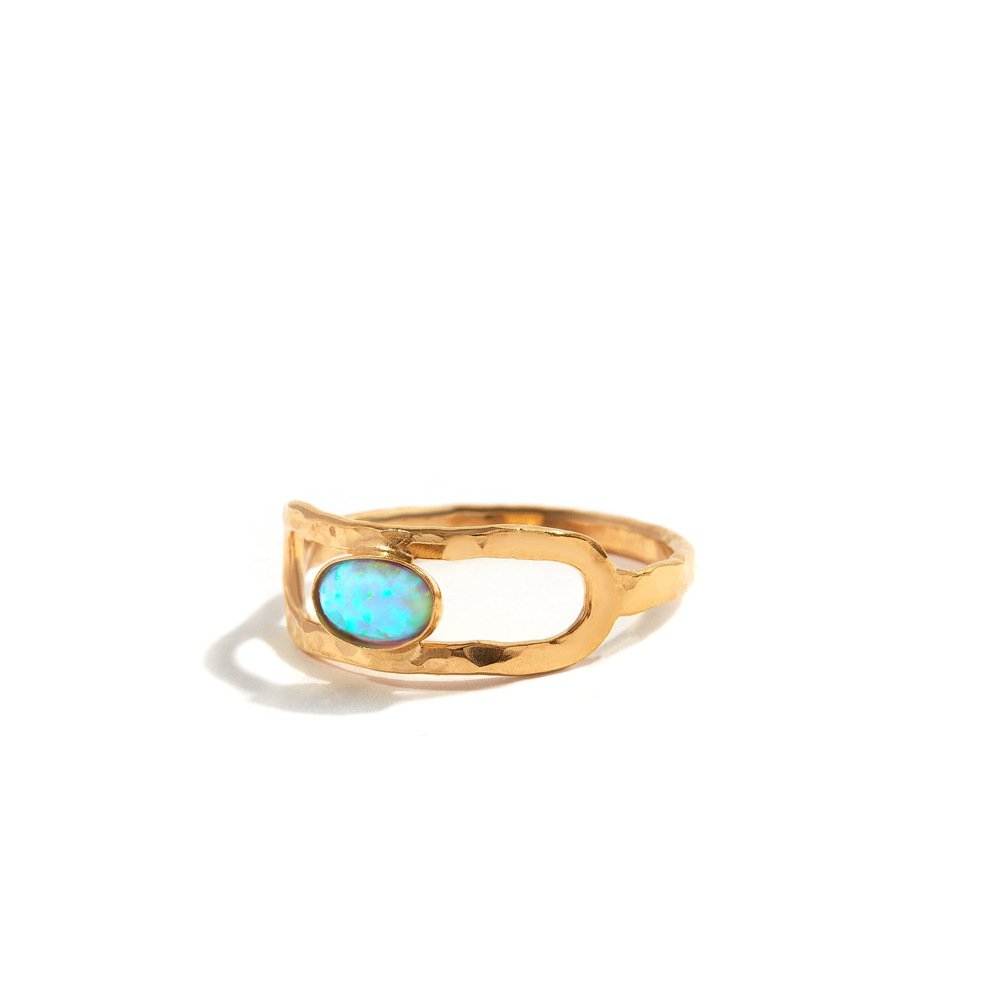 Dreamy Blue Opal Band Ring. It's a beautiful ring with a shiny blue opal. The design is modern and comfortable to wear.&nbsp; Perfect for adding a special touch to your everyday style
