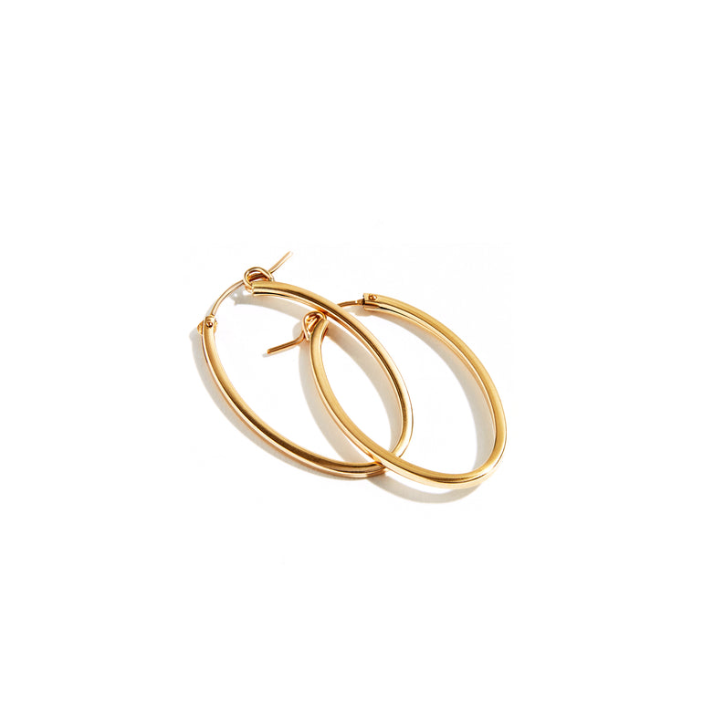 These elegant oval hoop earrings are crafted from a 2mm square tube, measuring 32mm by 21mm. The unique square tubing adds a modern touch to the classic hoop design, offering a sleek and sophisticated look. Perfect for both everyday wear and special occasions, these hoops blend timeless style with contemporary flair.