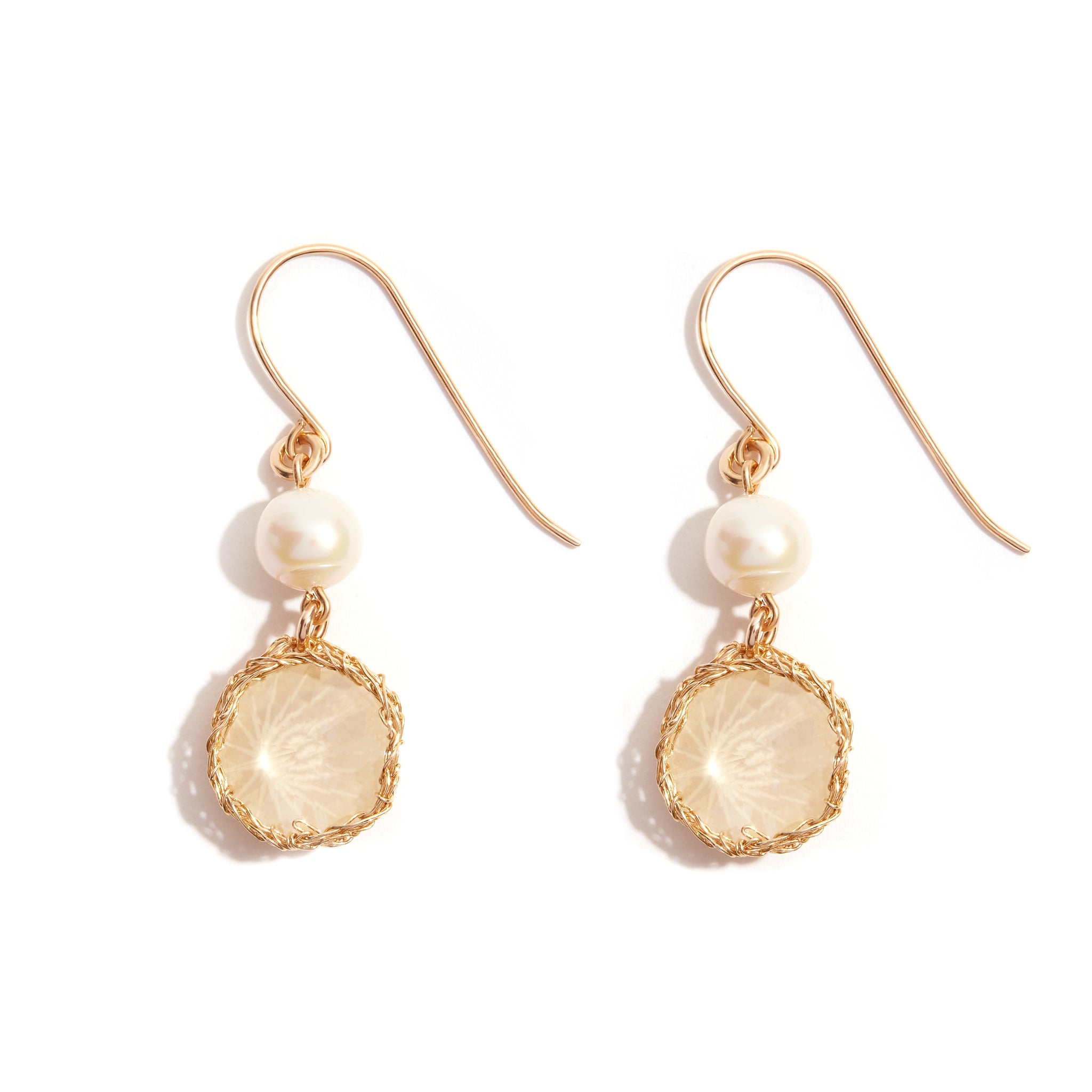 Serenity Opal Drop Earring crafted in 14ct gold-filled crochet, featuring a luminous pearl paired with a delicate sand opal stone. Radiate elegance and sophistication with this exquisite combination, perfect for any occasion