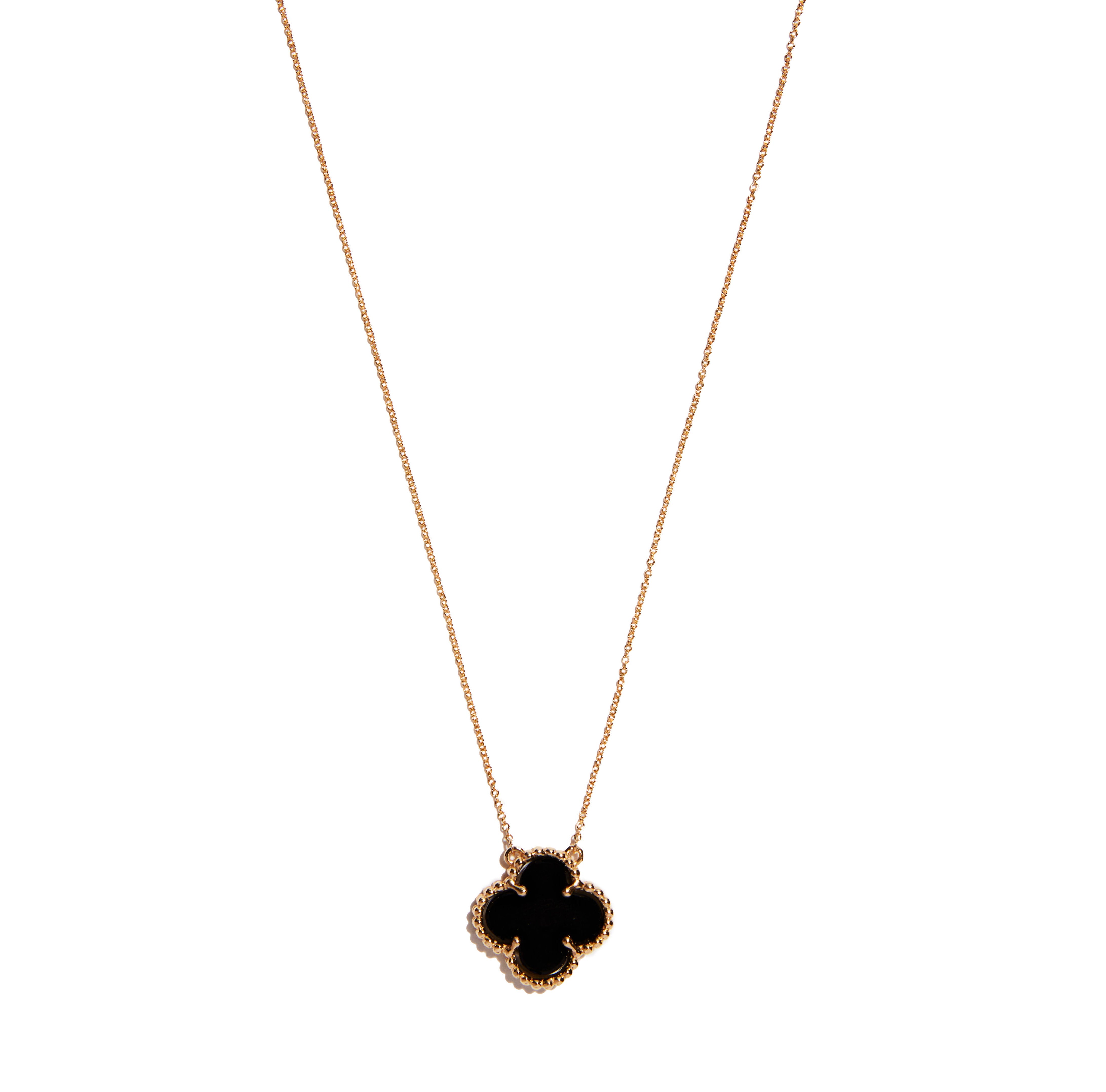 Enhance your look with the 9 carat yellow gold onyx clover pendant. This striking accessory features a captivating clover design crafted from sleek onyx stone, adding a touch of elegance and mystique to any outfit. A must-have piece for your jewelry collection.