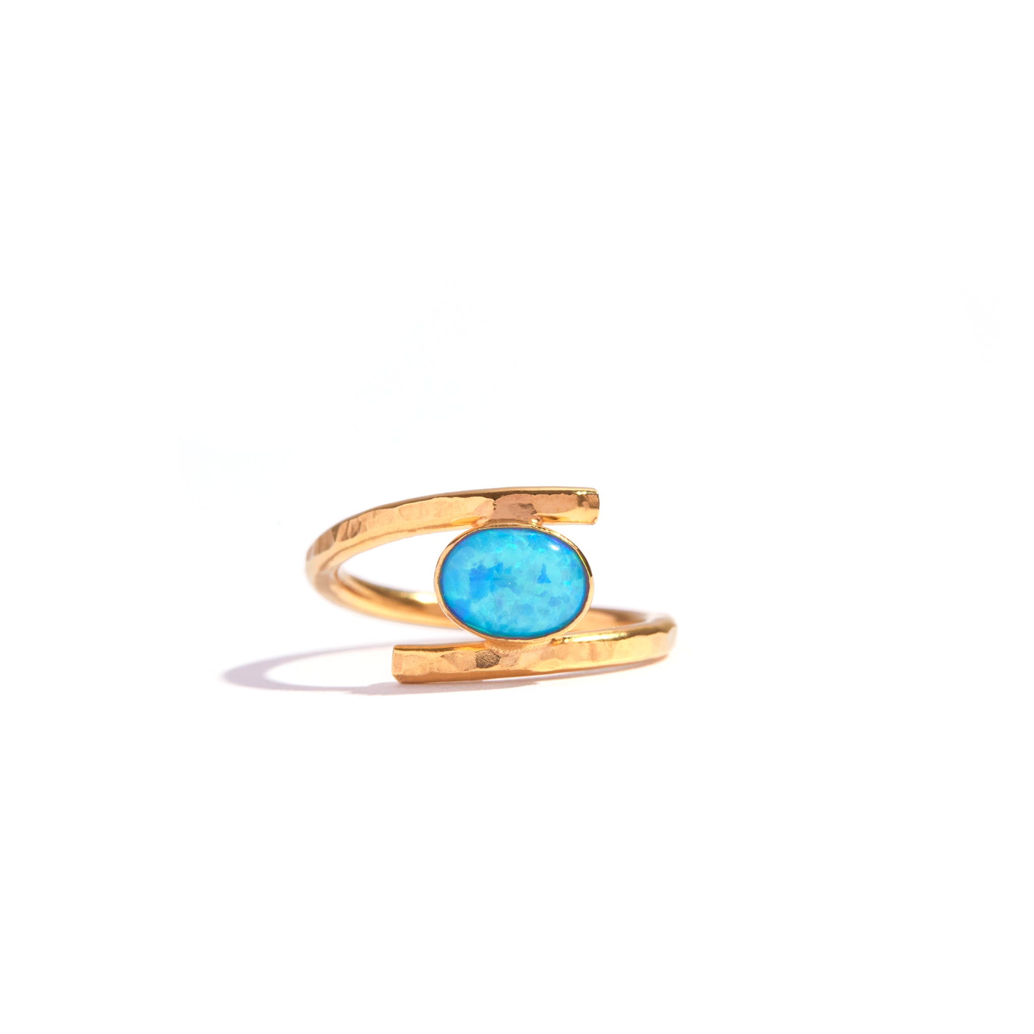 Blue Opal Gold Twist Ring featuring a stunning blue opal stone set in an elegant 14ct gold filled design. Combine opal's elegance with gold's sophistication. Add charm to any outfit with this luxurious and durable piece