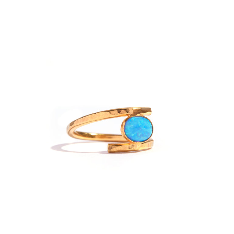 Blue Opal Gold Twist Ring featuring a stunning blue opal stone set in an elegant 14ct gold filled design. Combine opal's elegance with gold's sophistication. Add charm to any outfit with this luxurious and durable piece