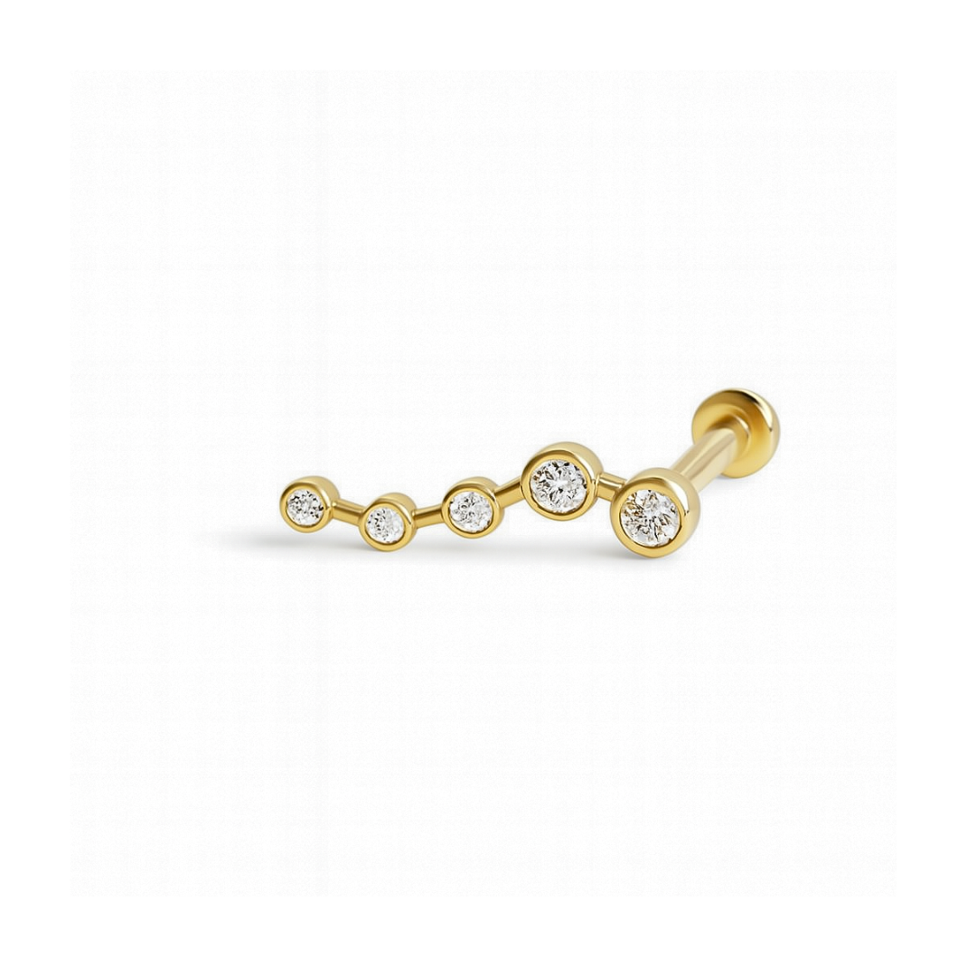 Gold barbell earring with three clear gemstones on a white background