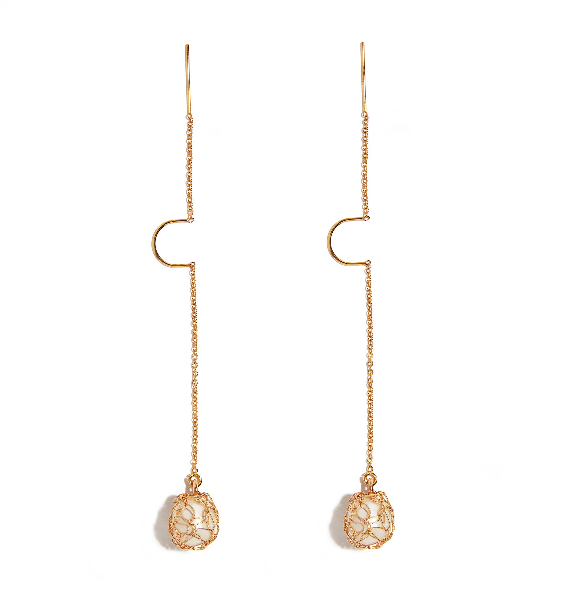 Pearl Dangle Treader Earring featuring a timeless design with lustrous pearls suspended delicately. Crafted with elegance, showcasing 14ct gold-filled accents, adding a touch of sophistication to your look.
