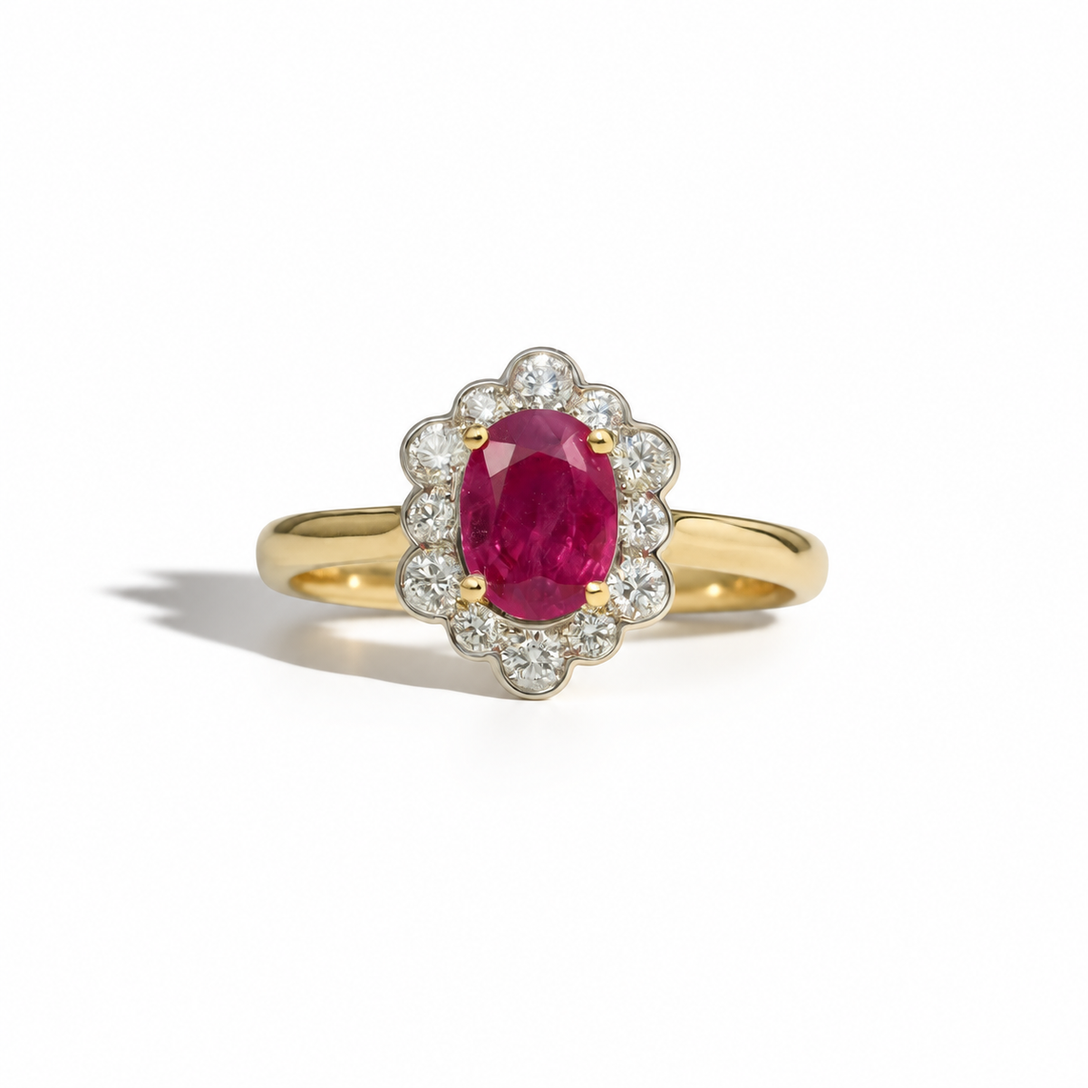 Vintage oval ruby and diamond halo ring in yellow gold with scalloped diamond surround