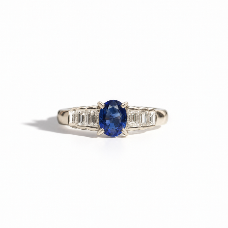 Vintage oval blue sapphire and baguette diamond ring in white gold