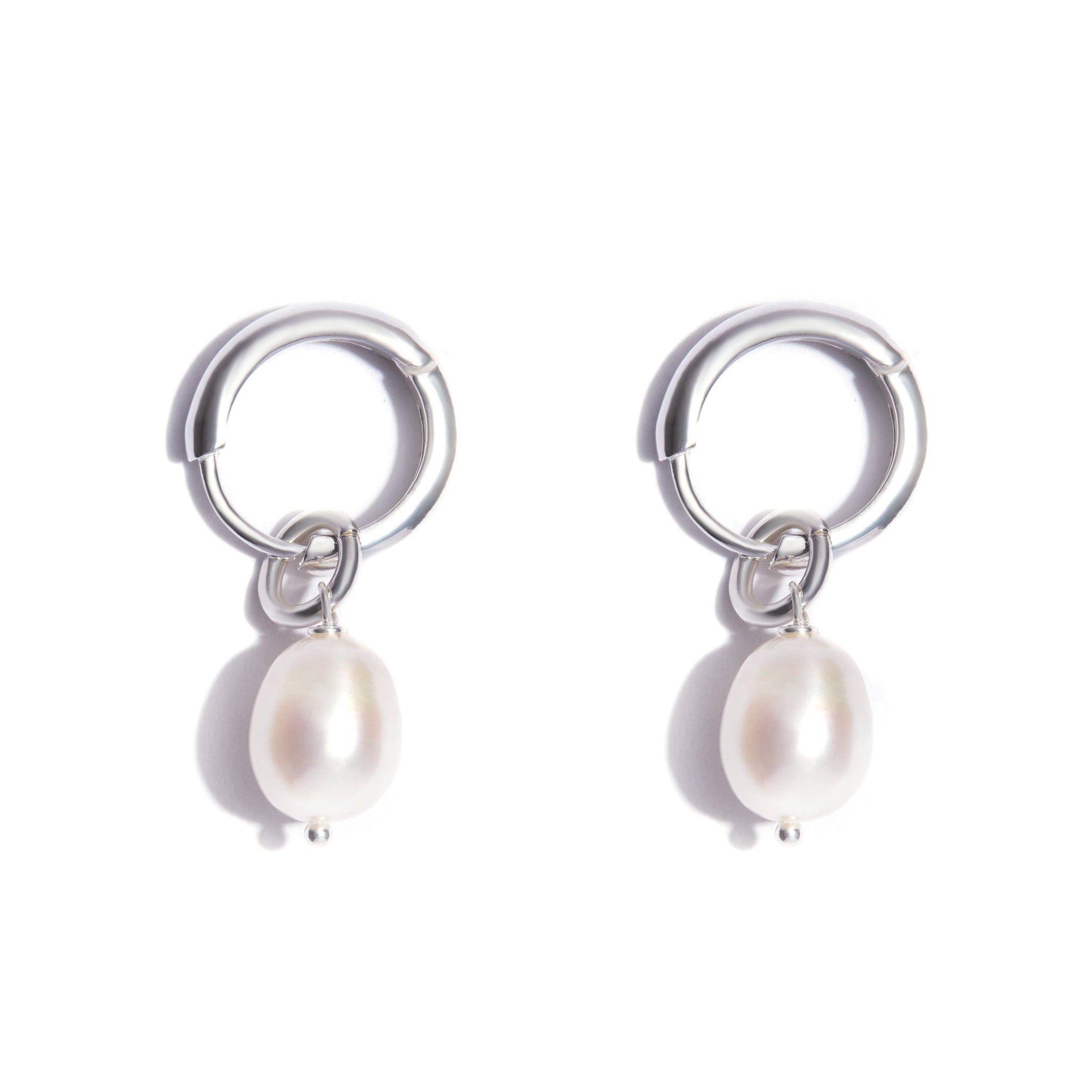 Sterling Silver Huggie Hoop Baroque Water Pearl Charm Earrings. Solid cast 10mm inside diameter hoops adorned with a single 10*8mm pearl. Suitable for all earlobes