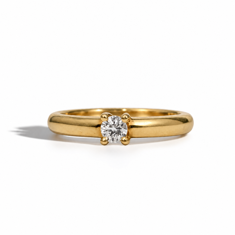  yellow gold ring featuring a sparkling 0.25 carat round brilliant diamond 
