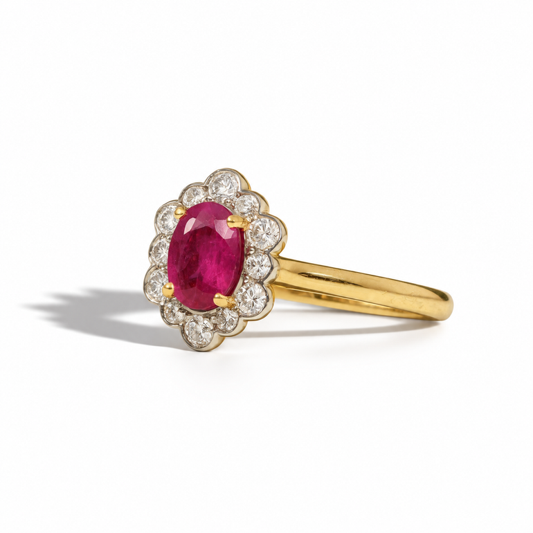 Vintage oval ruby and diamond halo ring in yellow gold with scalloped diamond surround