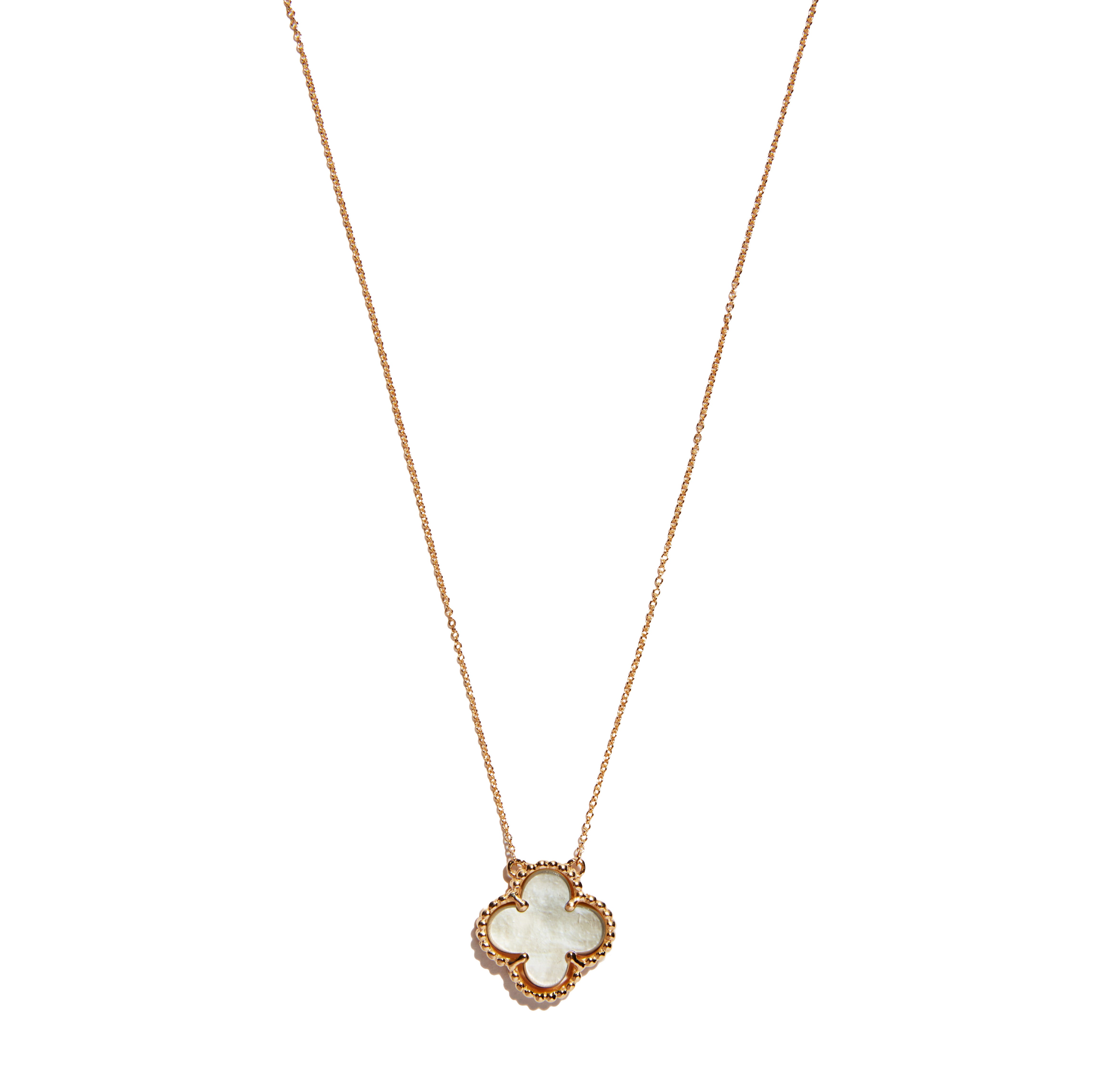 Discover the 9 carat yellow gold mother of pearl clover pendant. This elegant  accessory features a charming clover design crafted from lustrous mother pearl, adding a touch of sophistication and luck to any ensemble. a timeless piece for any jewelry collection.