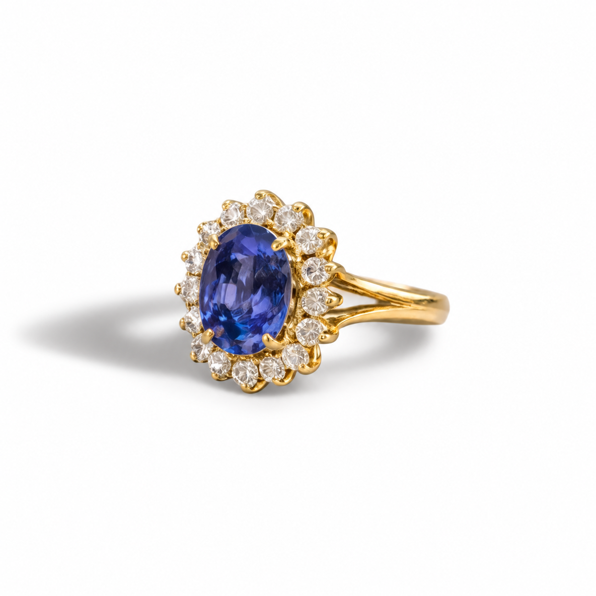A timeless classic with exceptional presence.

Crafted in 18ct yellow gold, this elegant ring features an oval-cut Ceylon sapphire, approximately 2.90ct, surrounded by a halo of diamonds that enhance its brilliance and depth of colour.

The sapphire has undergone heat treatment, a standard and widely accepted process used to enhance colour and clarity. Its rich blue tone is beautifully balanced by the surrounding sparkle, creating a refined and sophisticated piece.

With GIA certification, this ring carries