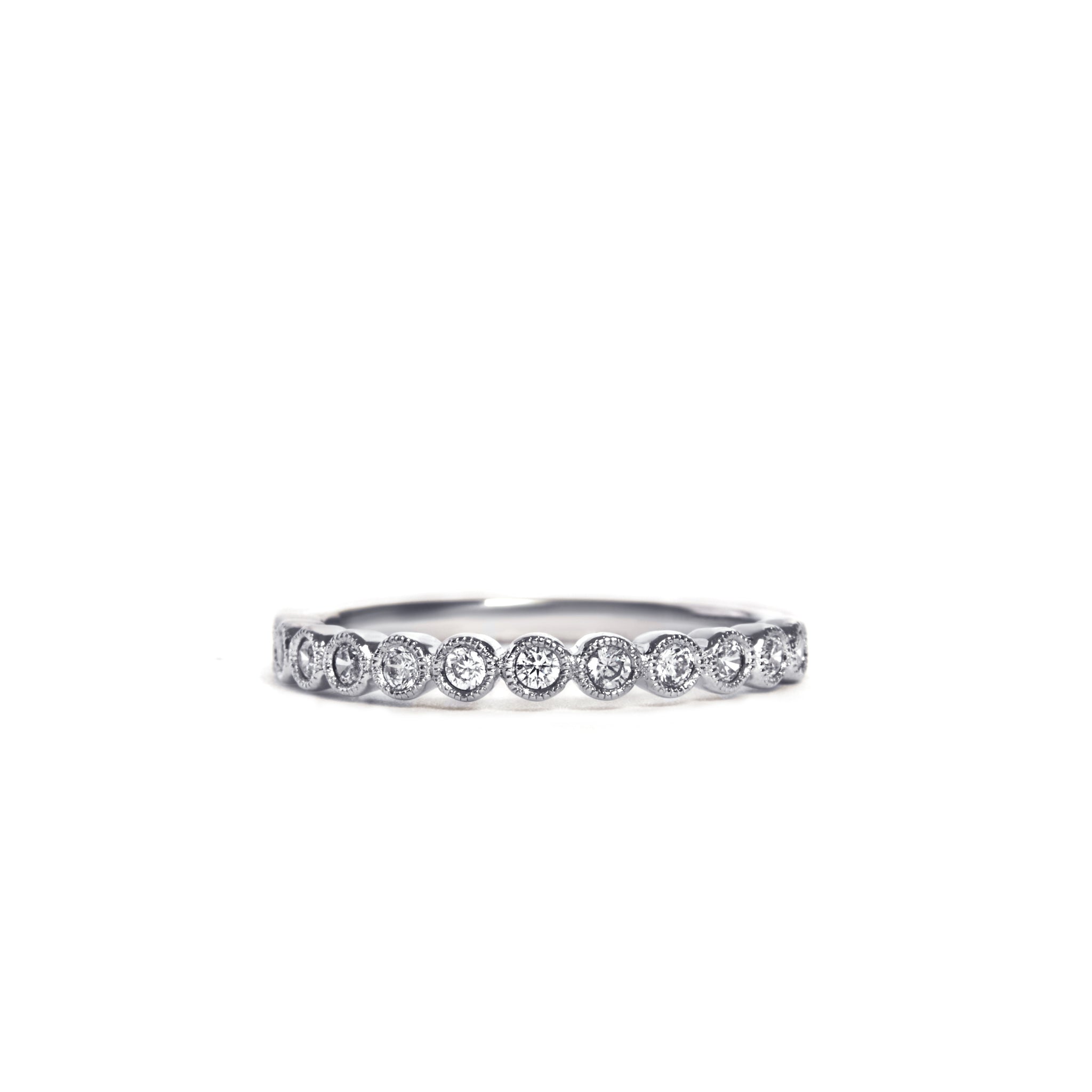 Exquisite 9ct White Gold Bezel Set Diamond Ring, featuring delicate 0.25ct Round Brilliant Cut Natural Diamonds in a millgrain bezel setting. Available in Yellow Gold and Platinum. Showcase elegance with G/H color and SI clarity diamonds