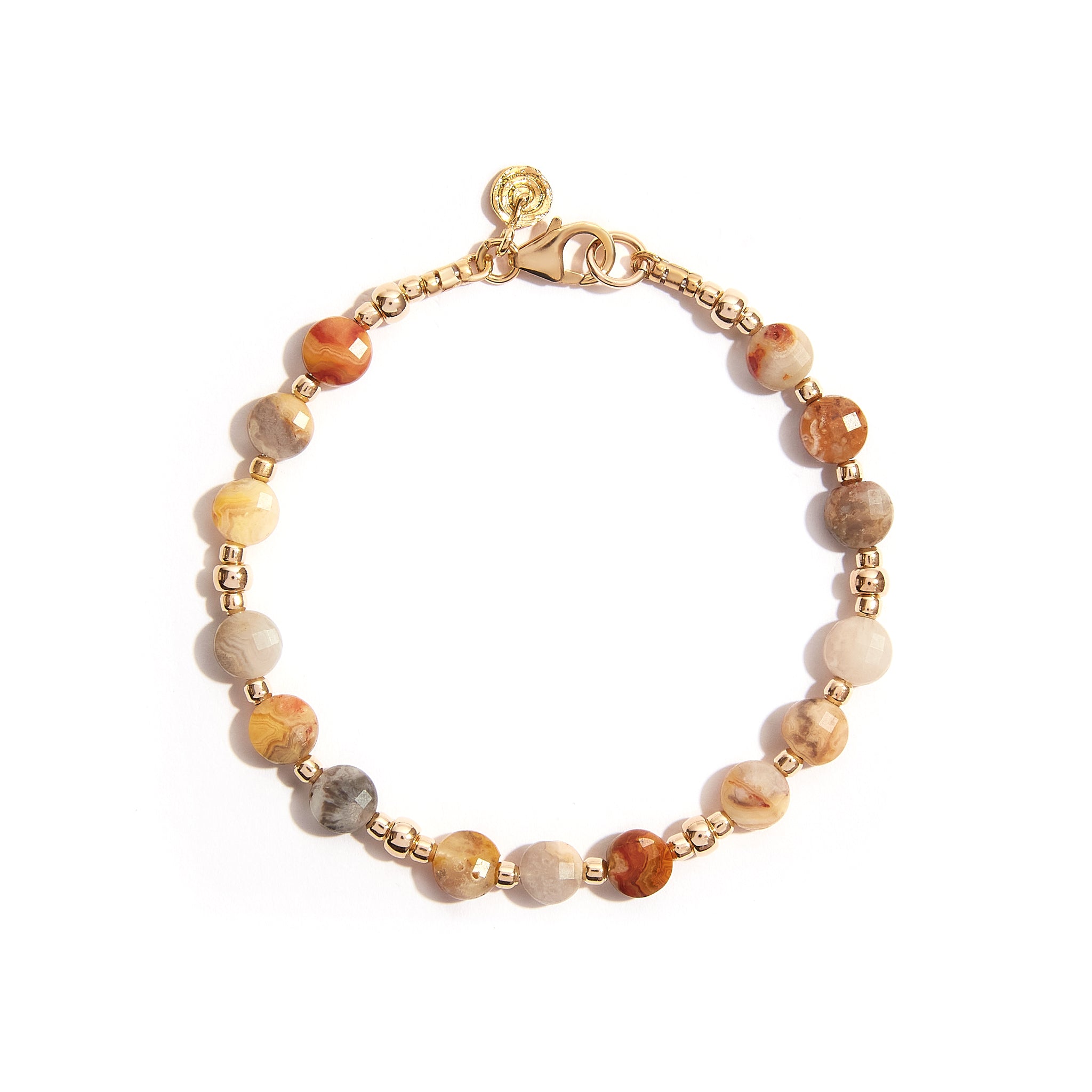 Introducing our Yellow Gold Sparkle Jasper Bracelet, a timeless embodiment of elegance and versatility. Crafted with meticulous care, this bracelet effortlessly captures attention with its understated charm. Material: 14ct Gold Filled. Length: 7 inches. Gemstone: Jasper. Cut: FacetCoin (6/4). Style: Elegant and versatile.