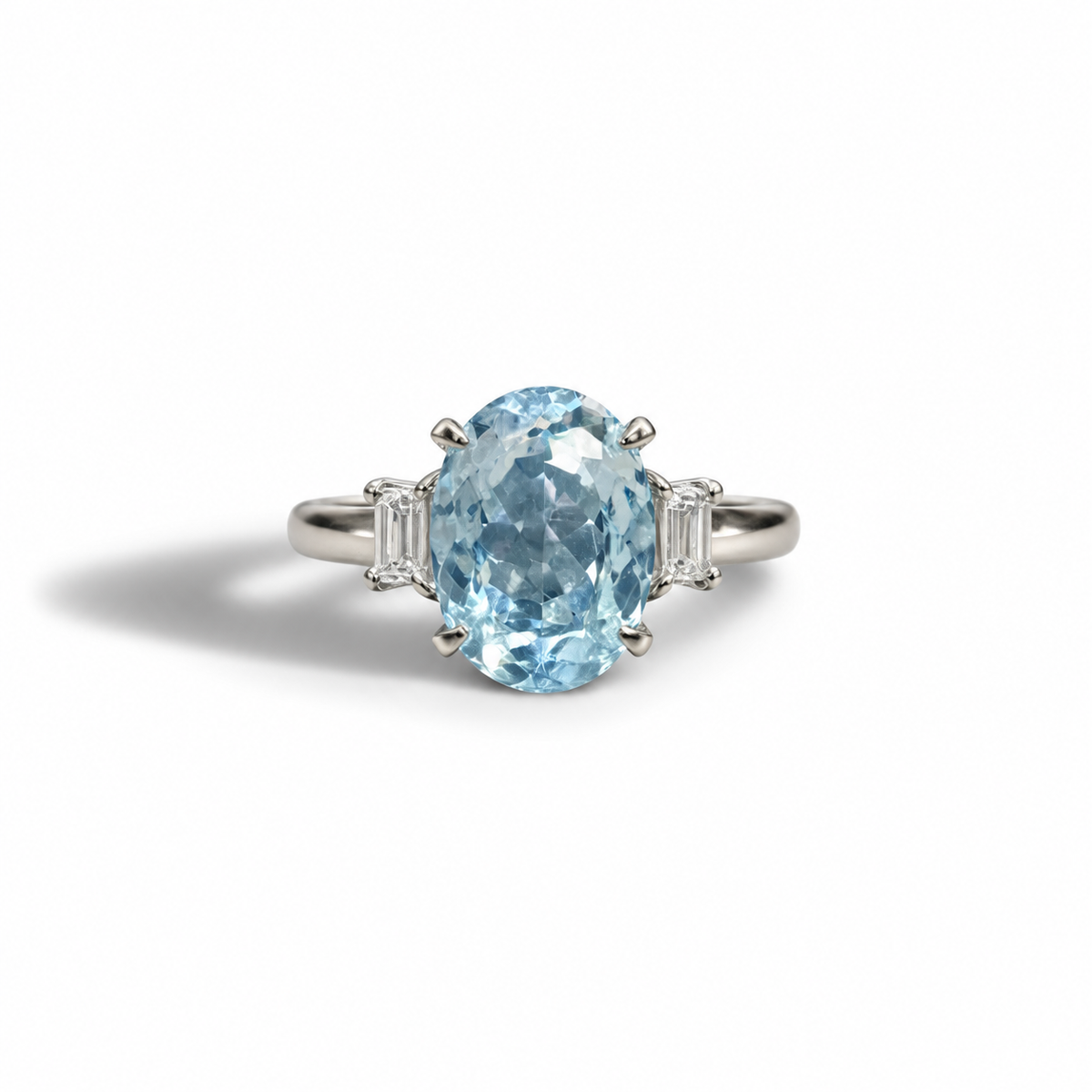 A refined vintage piece with a fresh, luminous feel.

Crafted in platinum, this ring features a striking oval-cut aquamarine at its centre, showcasing soft blue tones with beautiful clarity and light reflection. It is flanked by tapered baguette diamonds, adding structure and elegance to the design.

The cool tones of platinum paired with the icy blue aquamarine create a crisp, sophisticated look — classic yet quietly bold.

A timeless three-stone design that works beautifully as a statement ring or a uniqu
