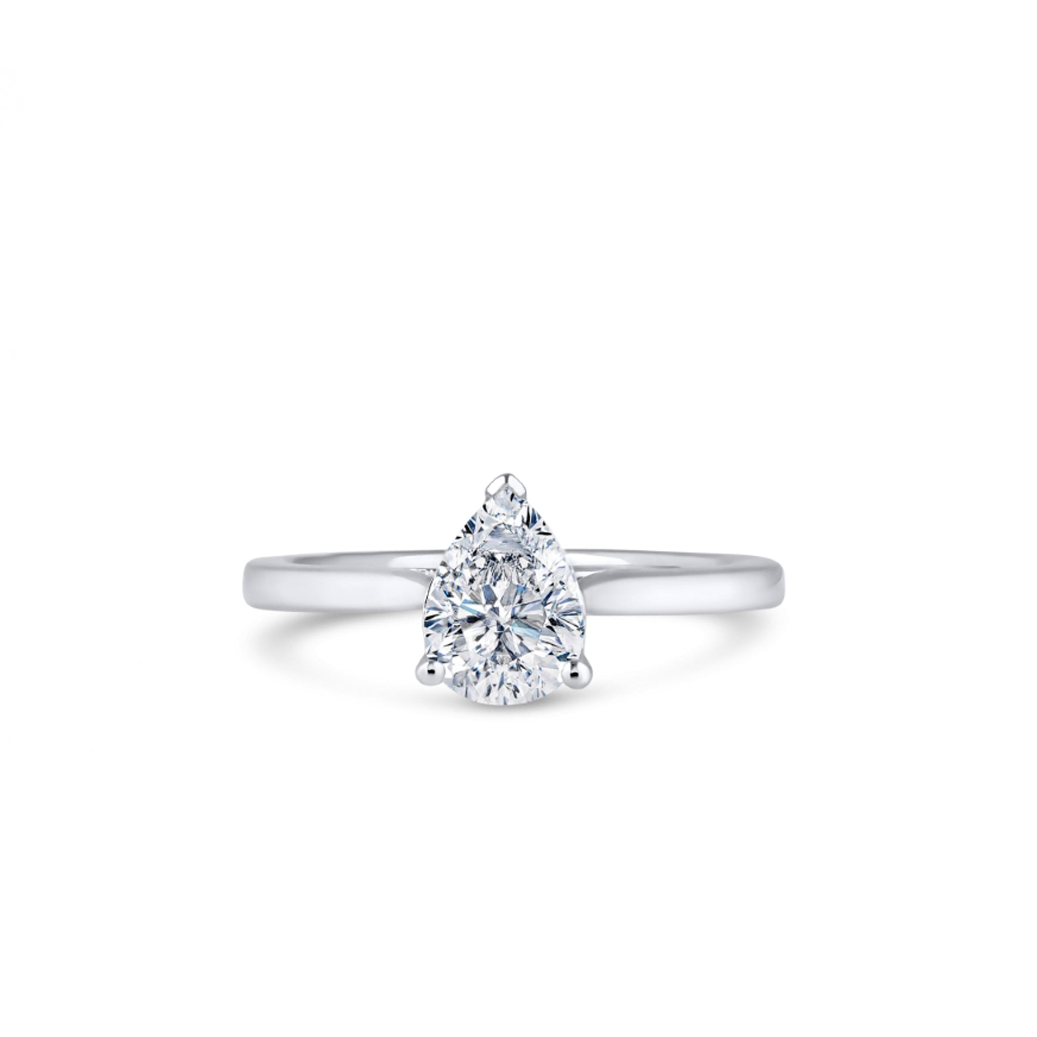 Experience timeless elegance with our 18ct Pear Cut Diamond Ring. Crafted with precision, it showcases a stunning 1.00ct pear-cut lab-grown diamond in luxurious 18ct gold. Each ring is made to order for a perfect fit and is available in Yellow Gold, White Gold, Platinum, or Rose Gold. Material: 18ct White Gold (Also Available in Yellow Gold, Rose Gold, or Platinum). Center Stone: 1.00ct Pear Cut Lab Grown Diamond. Characteristics: D Colour, VVS1 Clarity. Customization: Made to Order