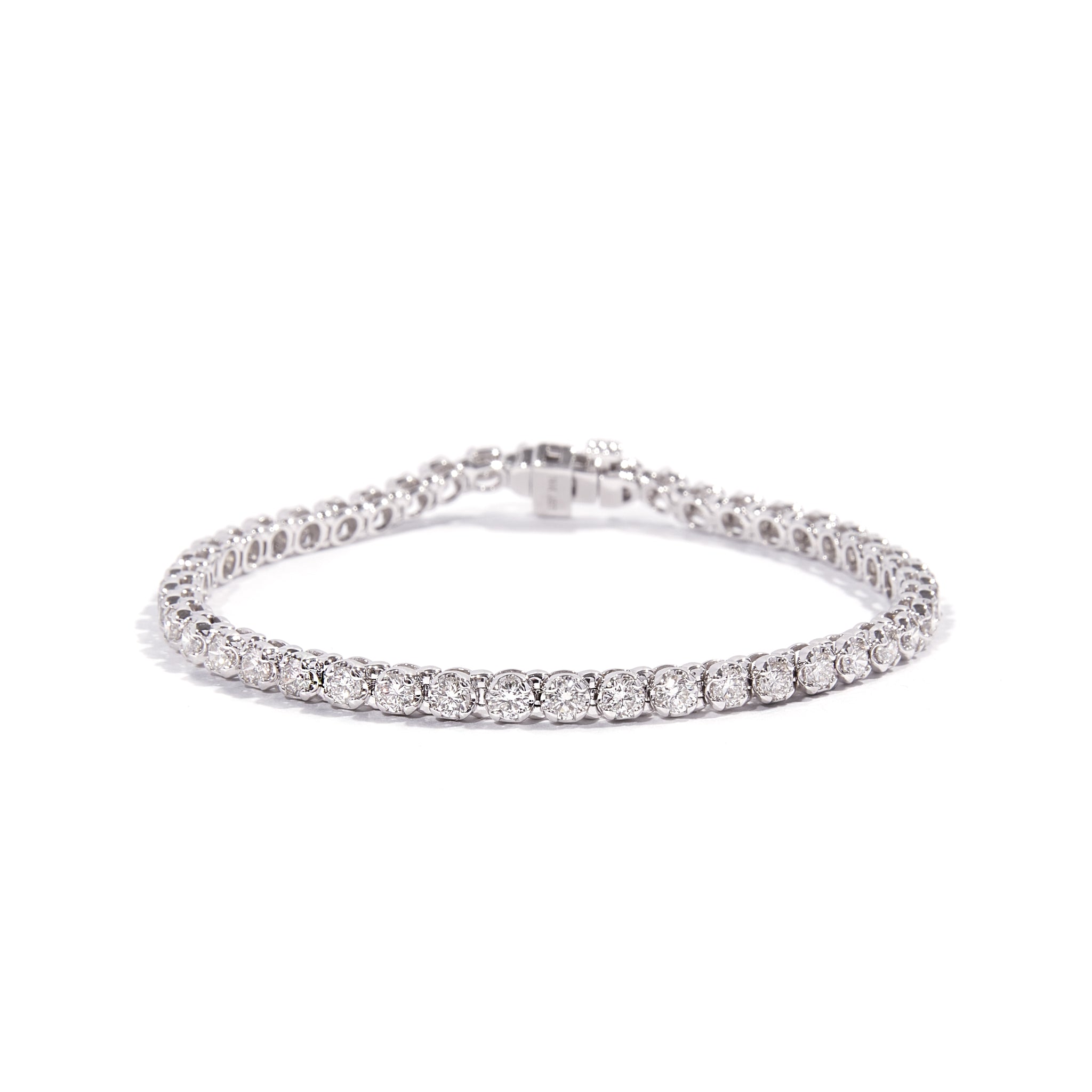 14ct White Gold Tennis Bracelet adorned with dazzling natural diamonds. Crafted in 14 carat white gold. Features a total of 4.00 carats of diamonds. Weighs 11.8 grams.