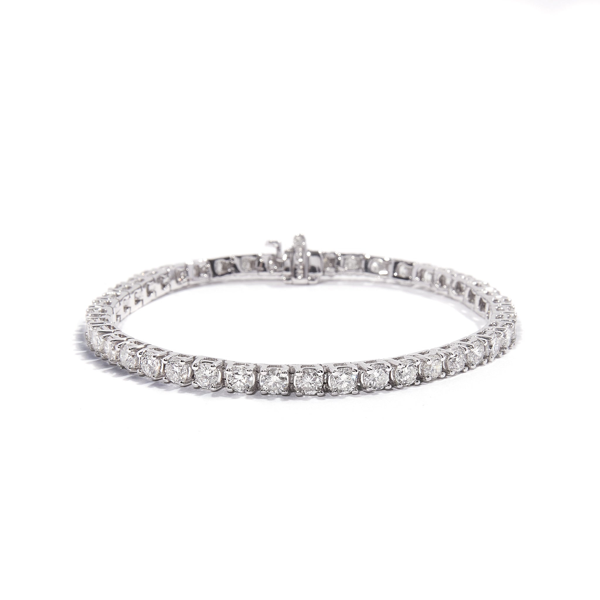 Exquisite 14ct White Gold Diamond Tennis Bracelet adorned with natural diamonds, crafted with precision. Crafted in 14 carat white gold. Features a total of 7.15 carats of diamonds. Weighs 13.73 grams