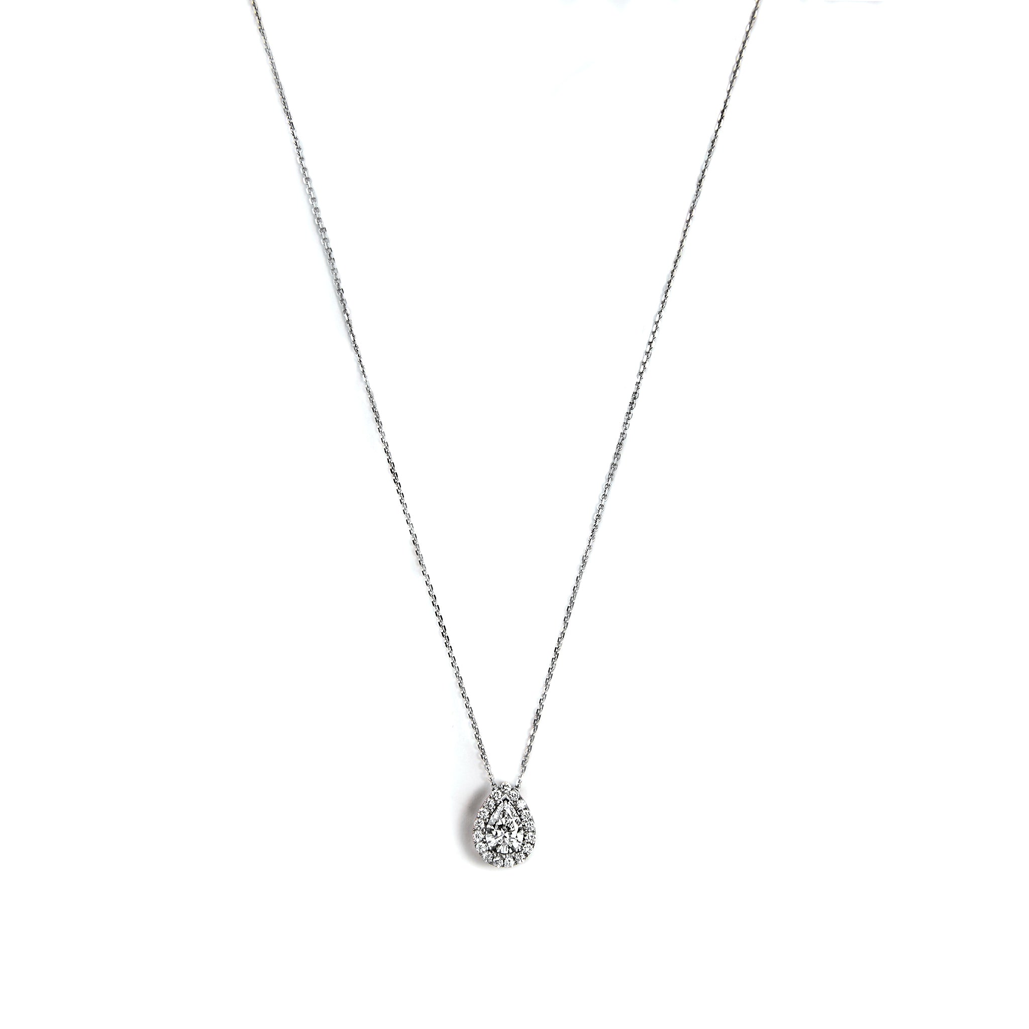 Exquisite 18k White Gold Pendant with Chain, symbolizing elegance and sophistication. Crafted with precision and adorned with sparkling diamonds. Material: 18k white gold. Pendant Measurements: 7.00 * 4.80 mm. Estimated Total Diamond Weight: 0.55 carats. Color: Near Colorless (g-h). Clarity: VS1.