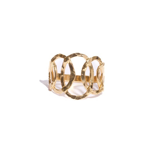 Gold ring with a small circular design on a white background