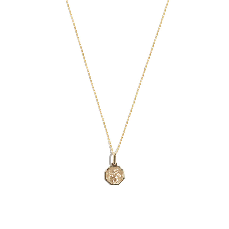 Discover the timeless elegance of the 9 carat yellow gold St Christopher Hex Necklace. This stunning accessory with the revered St Christopher, symbolizing protection and guidance during travels.