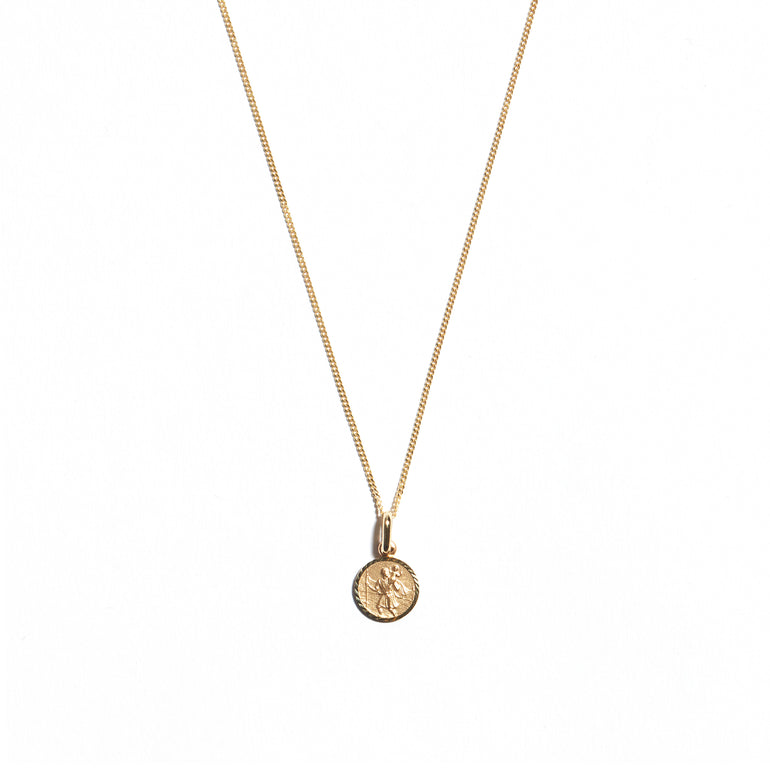 Elevate your look with the 9 carat yellow gold Small St Christopher Medal. This iconic accessory features a beautifully crafted medal depicting St Christopher, known for protection during travels. Perfect for adding a delicate touch of faith and style to your ensemble.