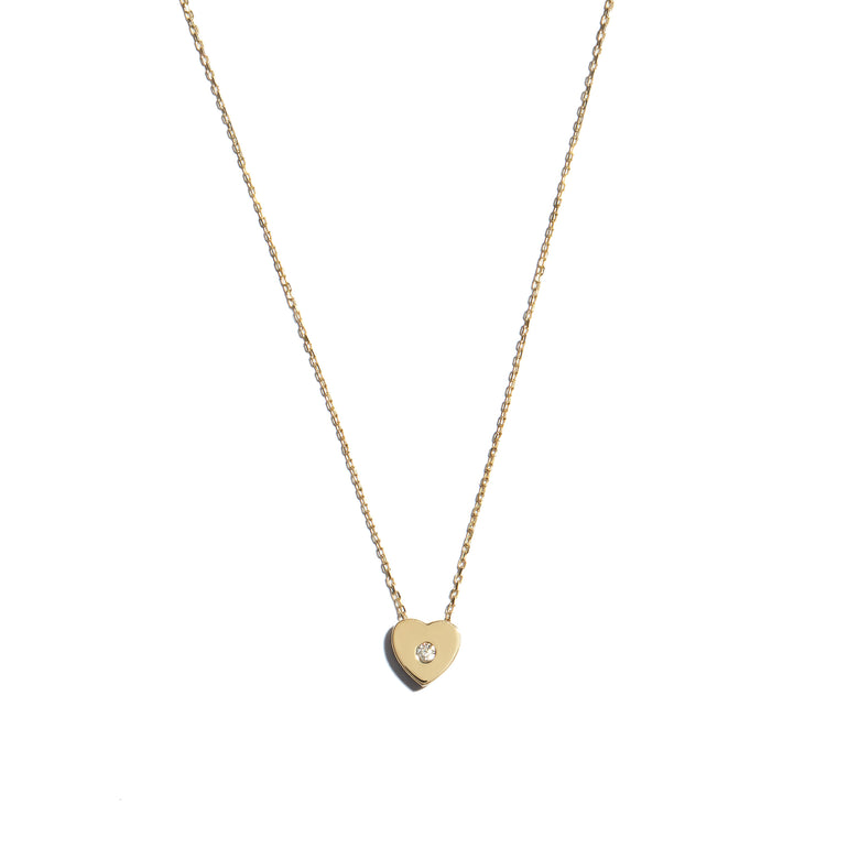 Elevate your style with the 9 carat yellow gold heart slider pendant. This charming accessory features a sleek and elegant heart-shaped design, perfect for adding a touch of romance to any outfit.
