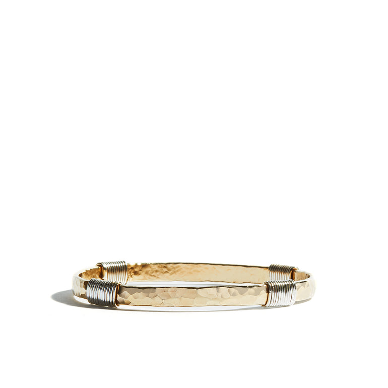 A chic gold wrap bangle crafted from 14ct gold fill, ideal for adding sophistication to your wrist.
