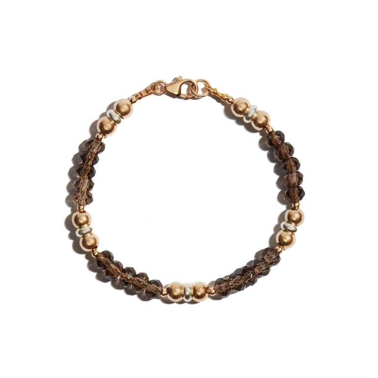 A stylish smokey quartz bracelet crafted from 14ct gold fill, perfect for adding a touch of sophistication to any ensemble.
