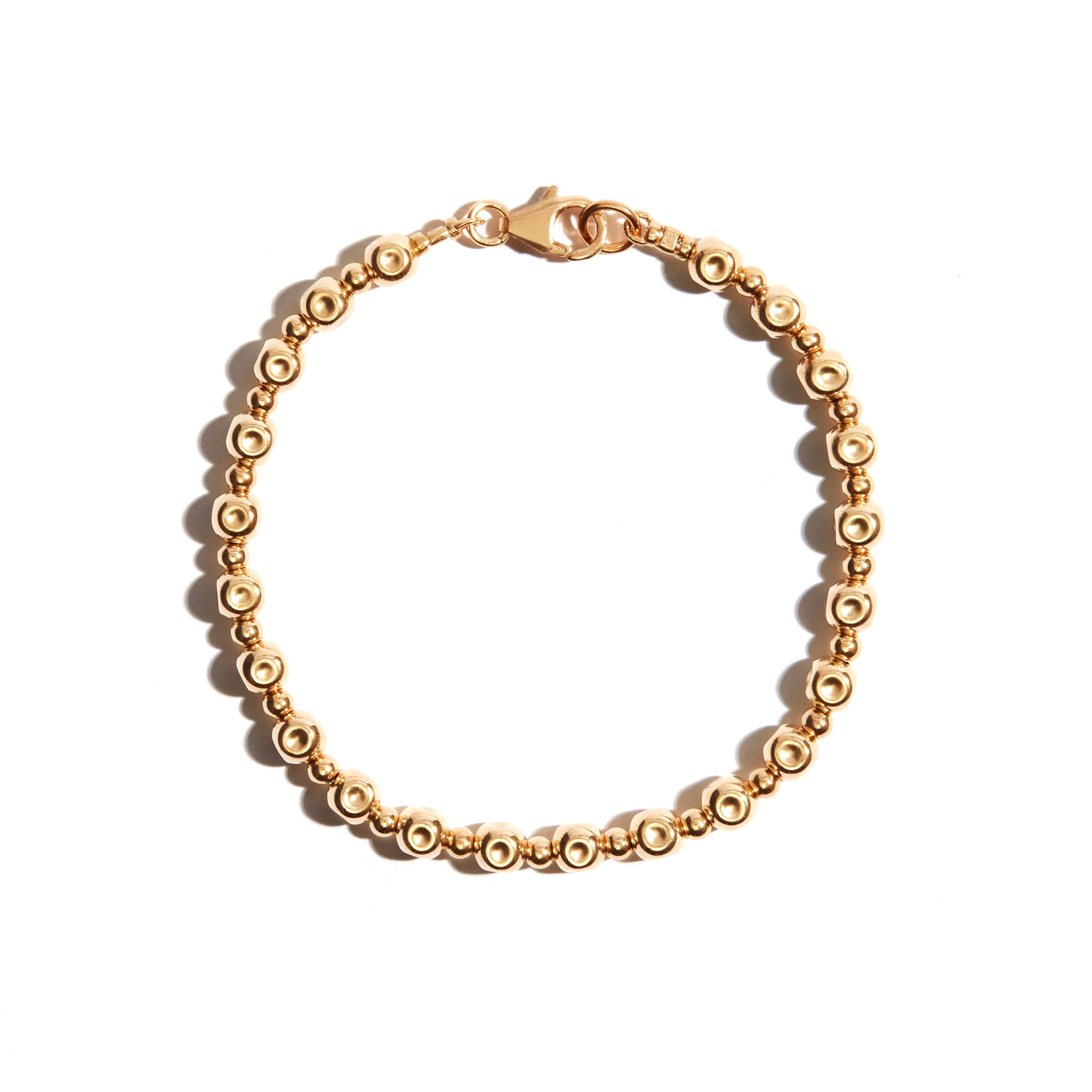 Our Beaten Beaded Bracelet is a classic style with beaten textured gold beads. Perfect when worn alone, but is also a perfect piece to add to layer up bracelets.