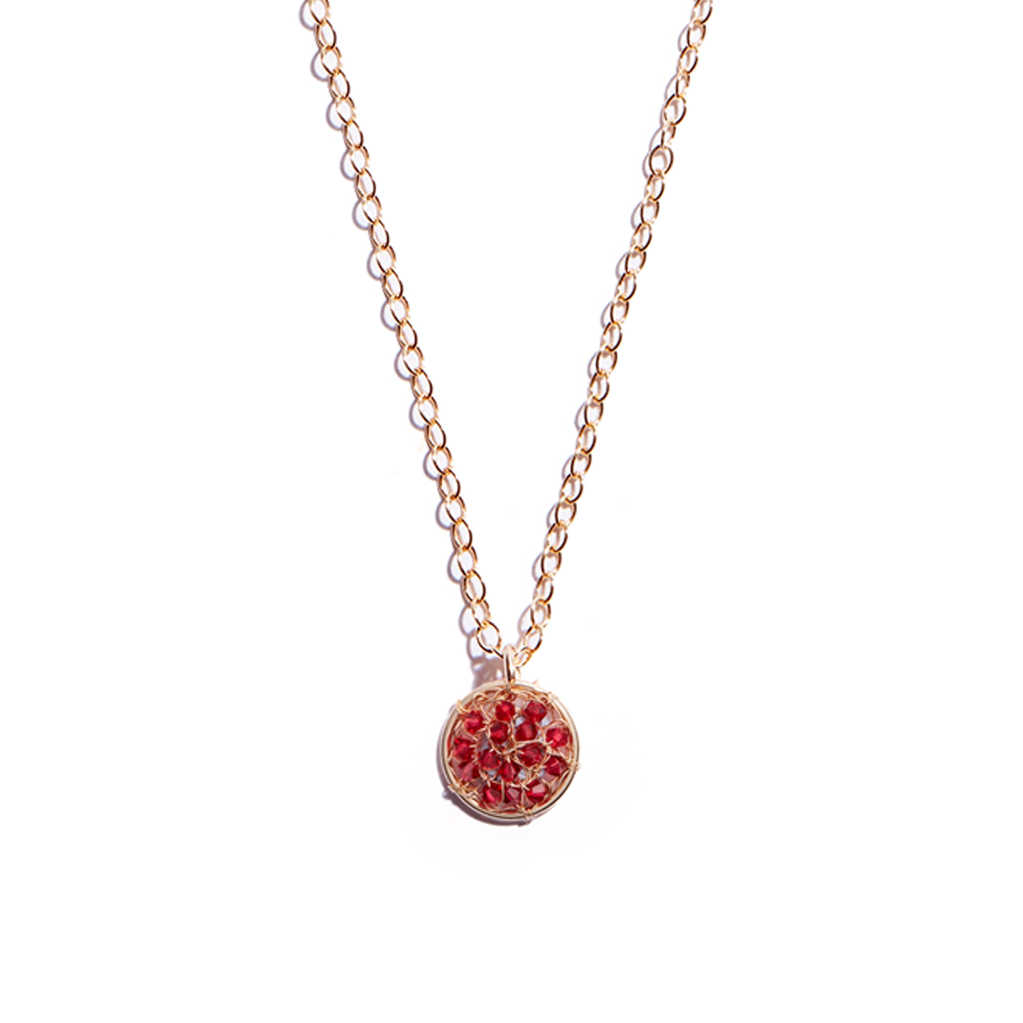 The Fí Ruby Red Pendant showcases our classic Fí design of delicate, woven gold but in this piece we have incorporated vibrant ruby hued gems to add a little something extra. This piece is perfect for adding a dramatic pop of red to your outfit.