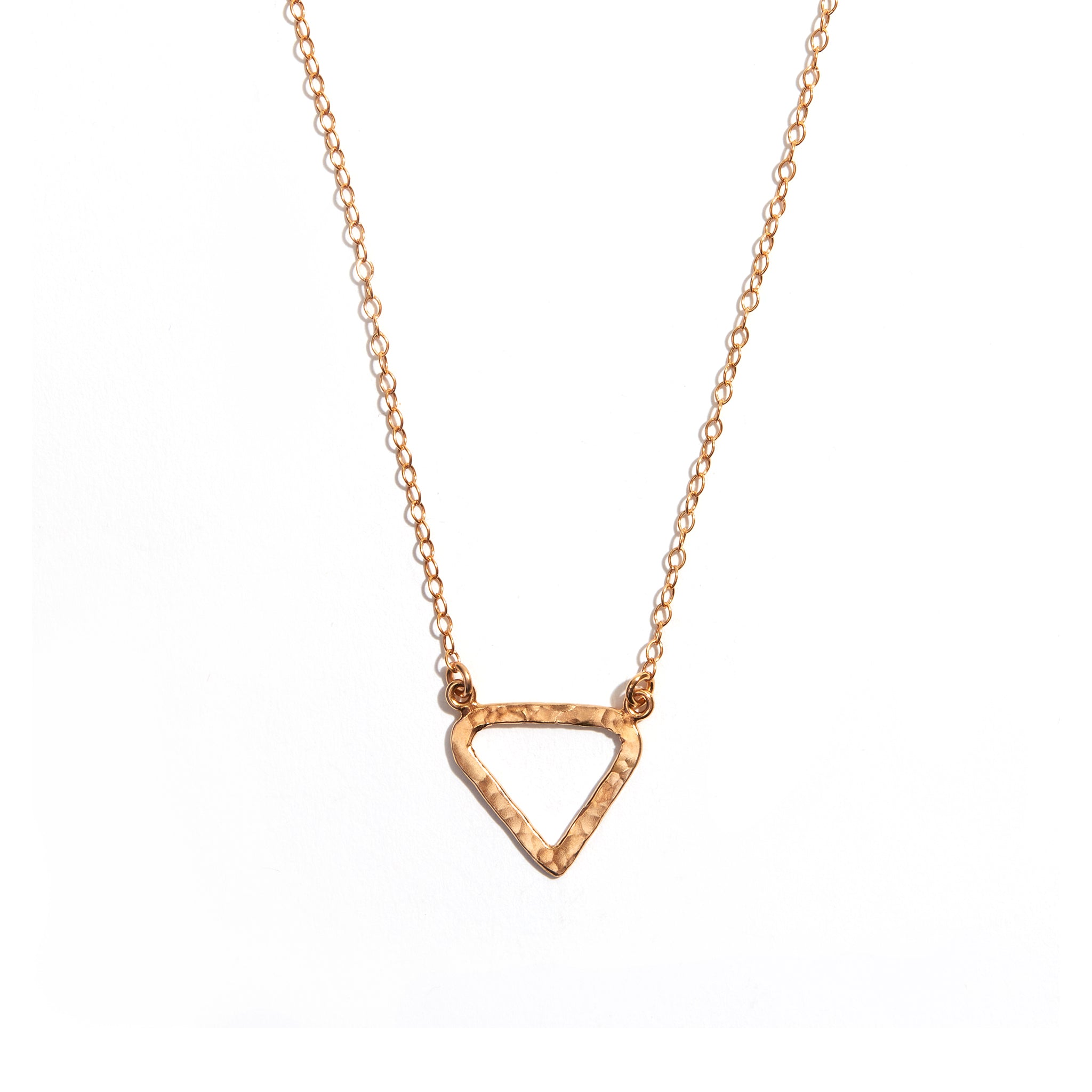 Photo of a gold triangle pendant made from 14 carat gold fill. A charming accesory ideal for gifting or adding a touch of elegance to any outfit.