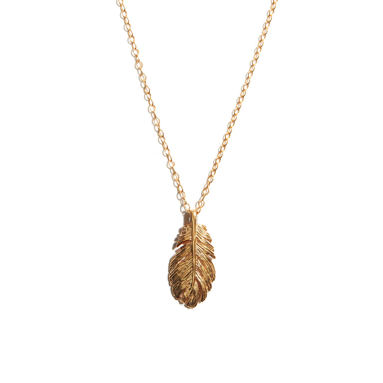 Gorgeous feather pendant crafted from 14 carat gold-fill, adding a touch  of nature-inspired elegance to any ensemble.