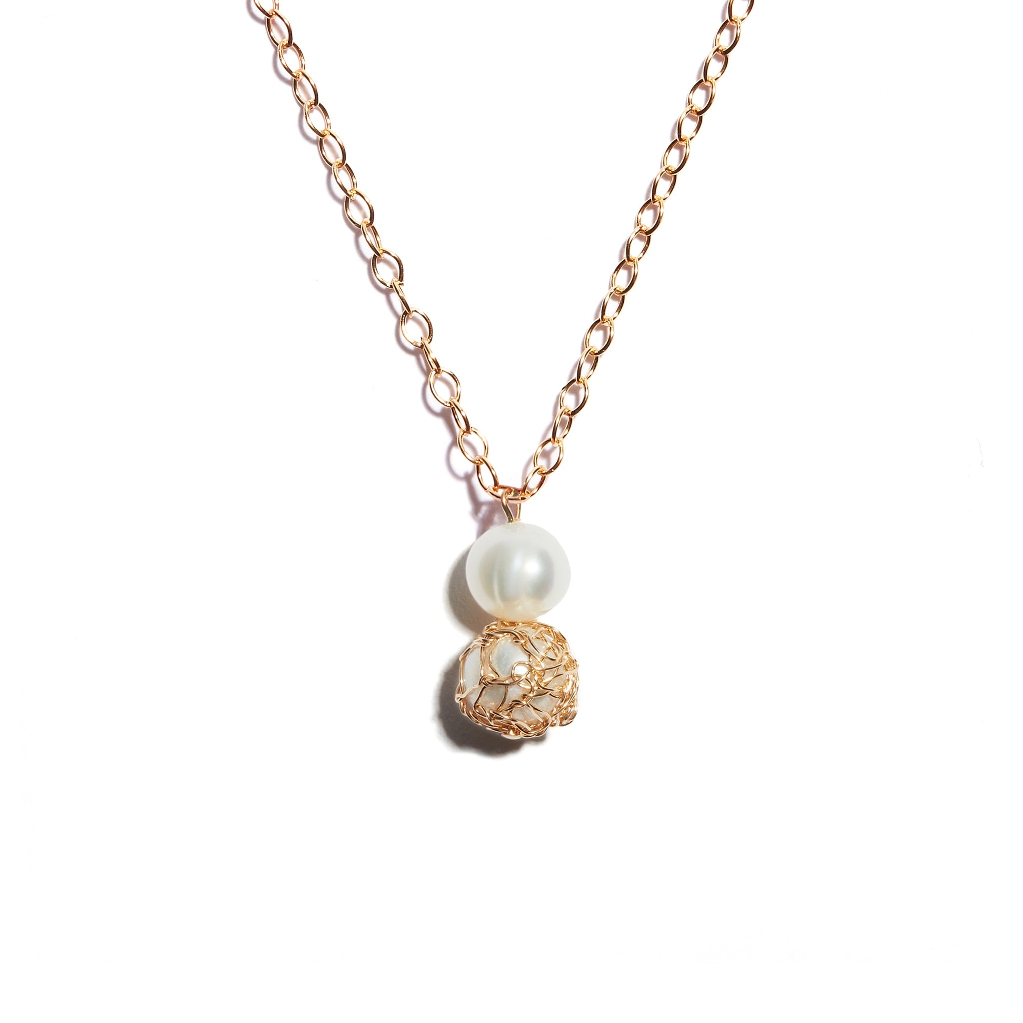 Exquisite double pearl pendant featuring crochet detailing on one pearl, crafted from high-quality sterling silver, adding sophistication and uniqueness to your ensemble.