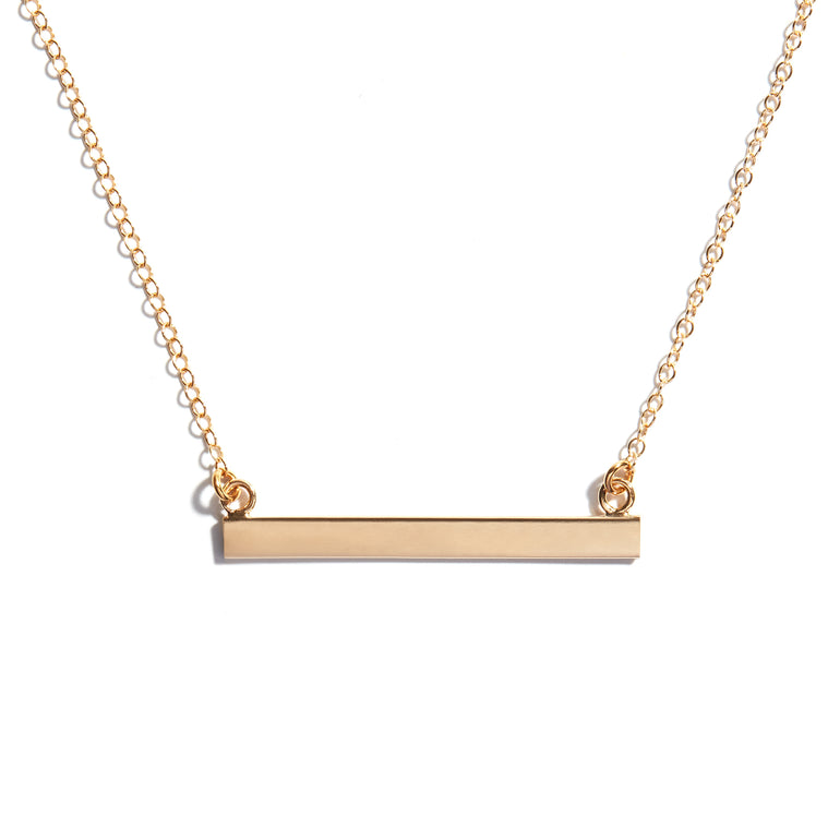 Close-up photo of an Engreavable Bar Necklace in 14 carat gold-fill.