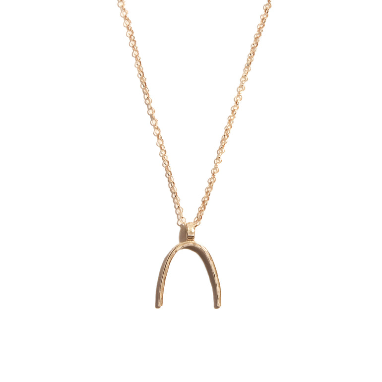 Elegant horse shoe pendant crafted from luxurious 14 carat gold-fill, symbolizing luck and style for any occasion.