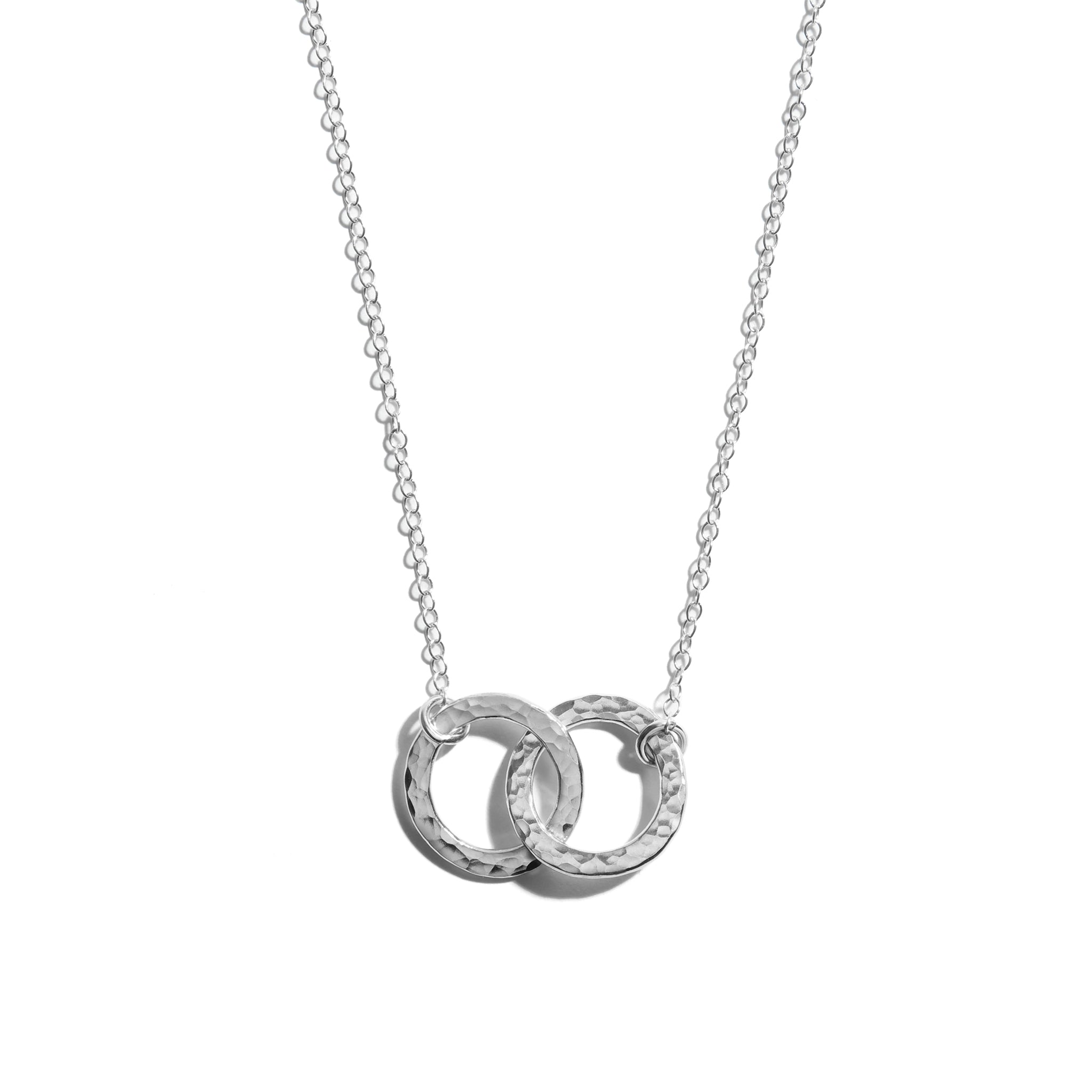 Photo of a small double circle necklace crafted from sterling silver. This elegant piece makes the perfect gift for someone special.