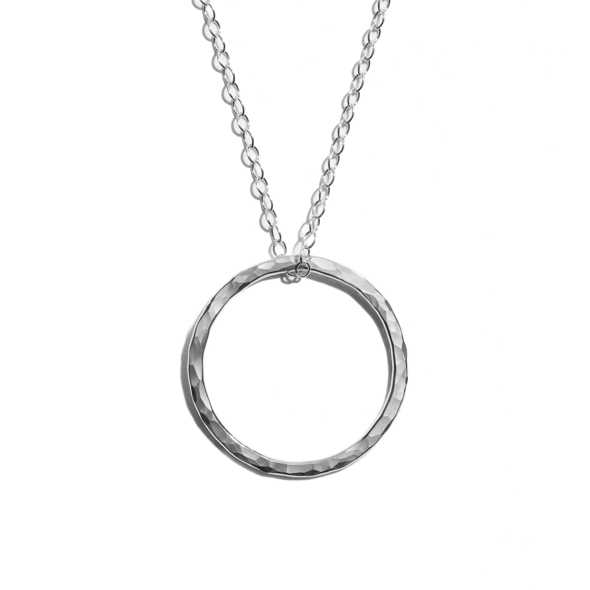 Photo of a luxurious silver medium open circle pendant. Perfect for adding elegance to any outfit.