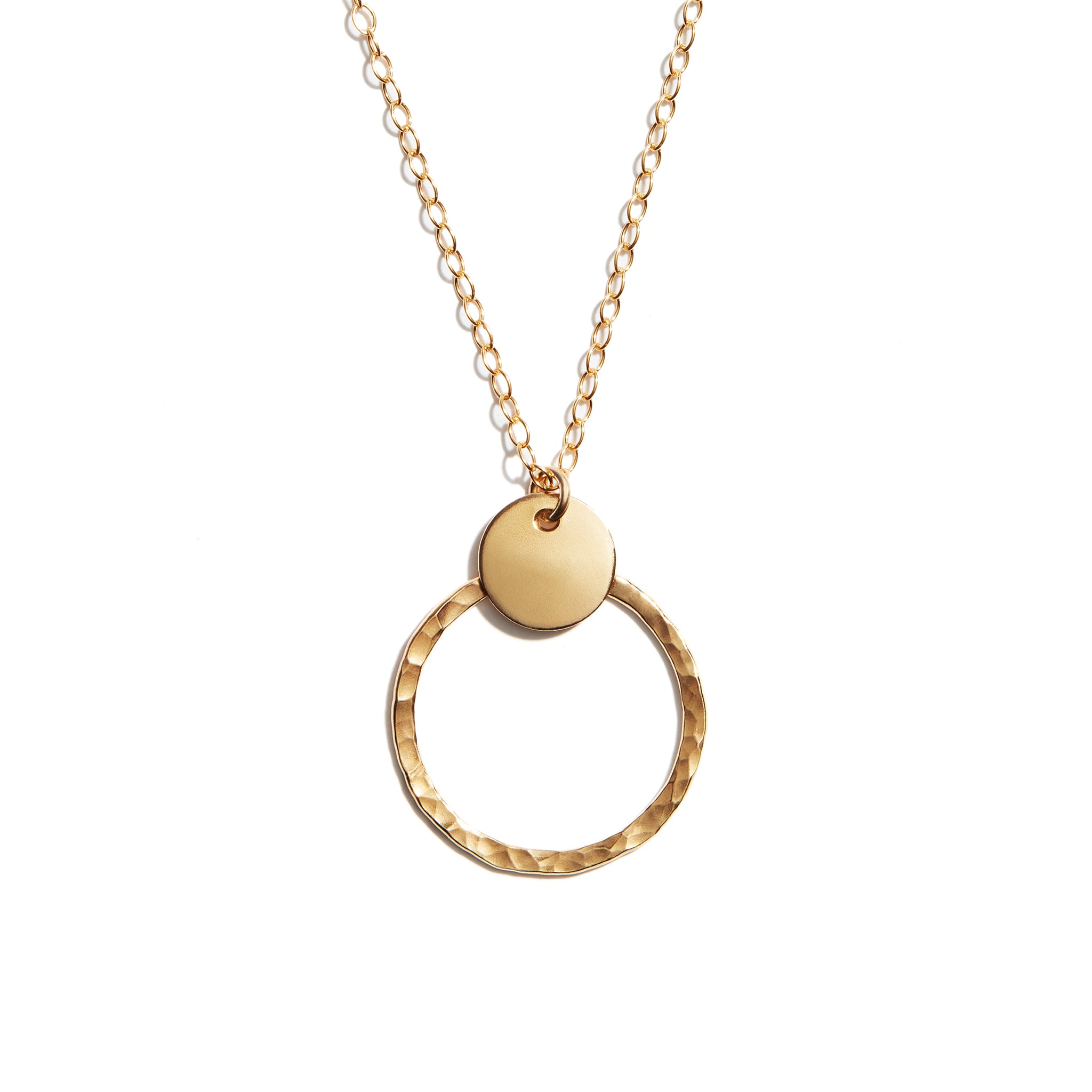 Close-up photo of a duo disk necklace crafted from 14 carat gold fill. Perfect for adding elegance to any outfit.
