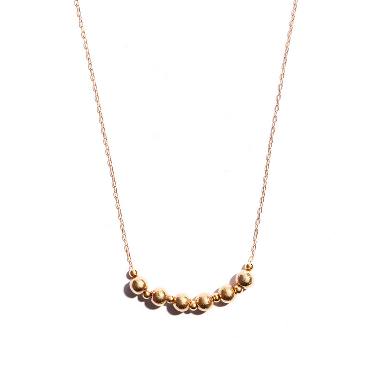 Stunning Seoidín Ball Pendant crafted from 14 carat gold-fill, radiating timeless sophistication and charm.